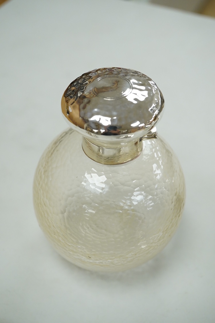 A collection of silver or white metal to include a miniature model dhal, ashtray, scent bottle and toilet jar, together with a metal Ronson table lighter.